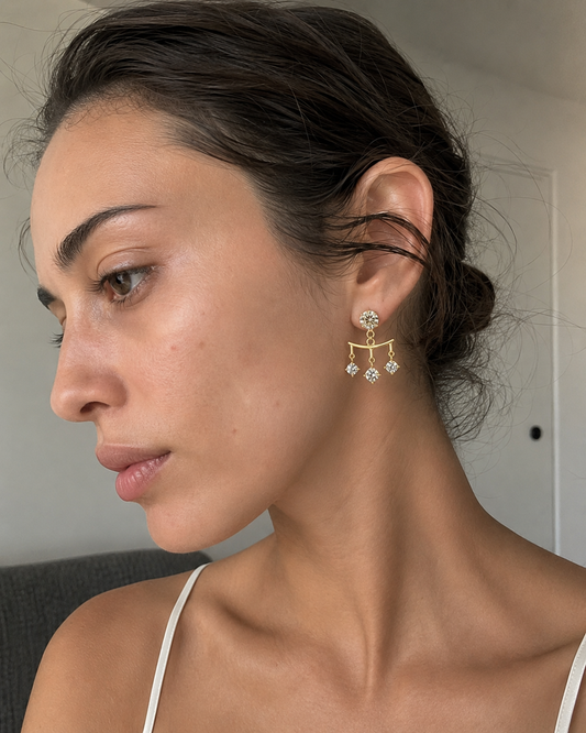 Classic Moissanite Drop Earrings, angled view of the round-stone drop setting