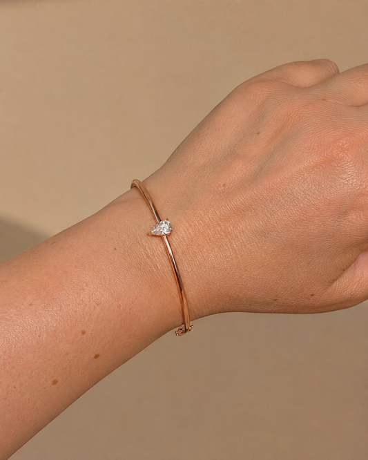 Zethech Pear Solitaire Bangle clean product image with pear-cut moissanite