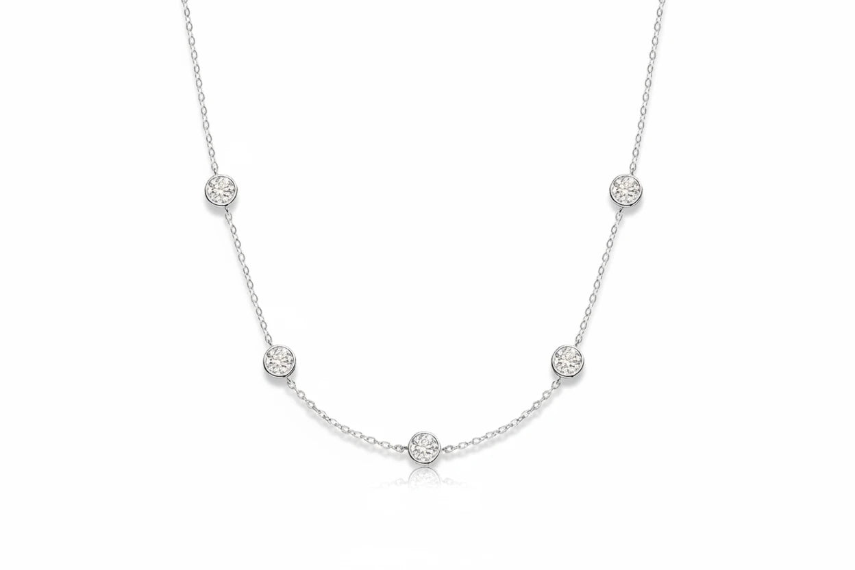 Elegant Bubble Moissanite Necklace by Zethech featuring sparkling round moissanite stones on a delicate chain.