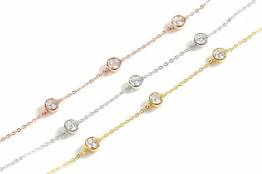 Elegant Zethech Bubble Moissanite Necklace with a sparkling, round-cut gemstone on a delicate chain.