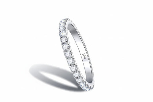 Silver moissanite eternity band ring by Zethech with sparkling round cut stones encircling the entire band.