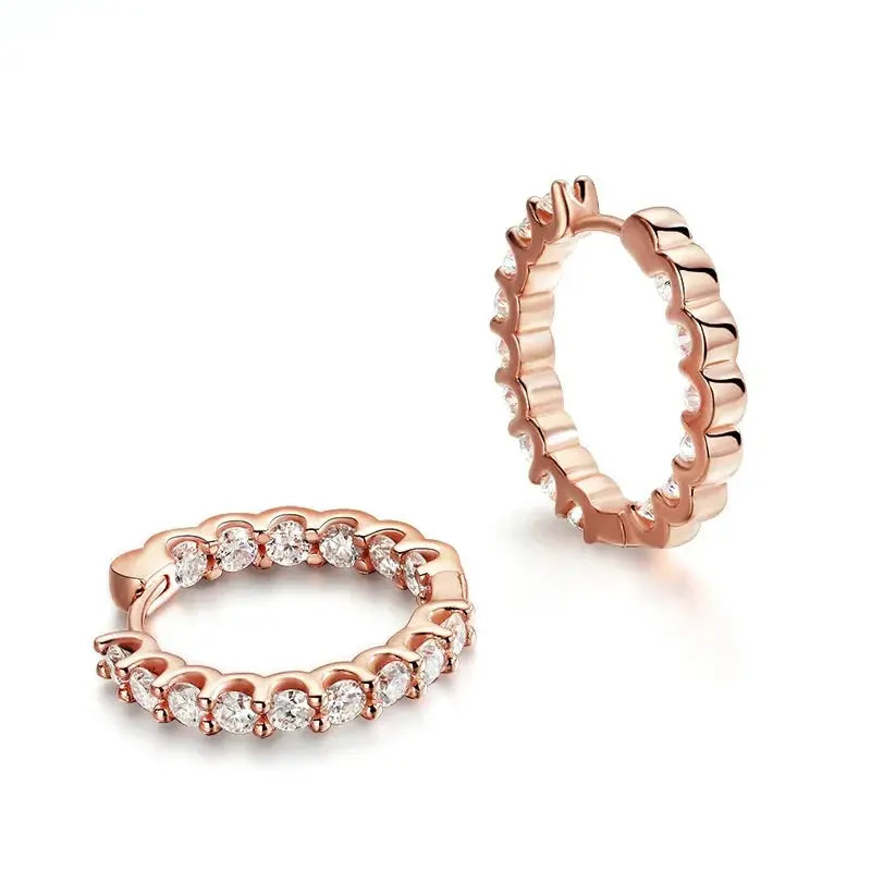 Gold-colored Zethech Eternal Glow 2.5mm full moissanite hoop earrings, close-up of sparkling gemstone-adorned earrings.