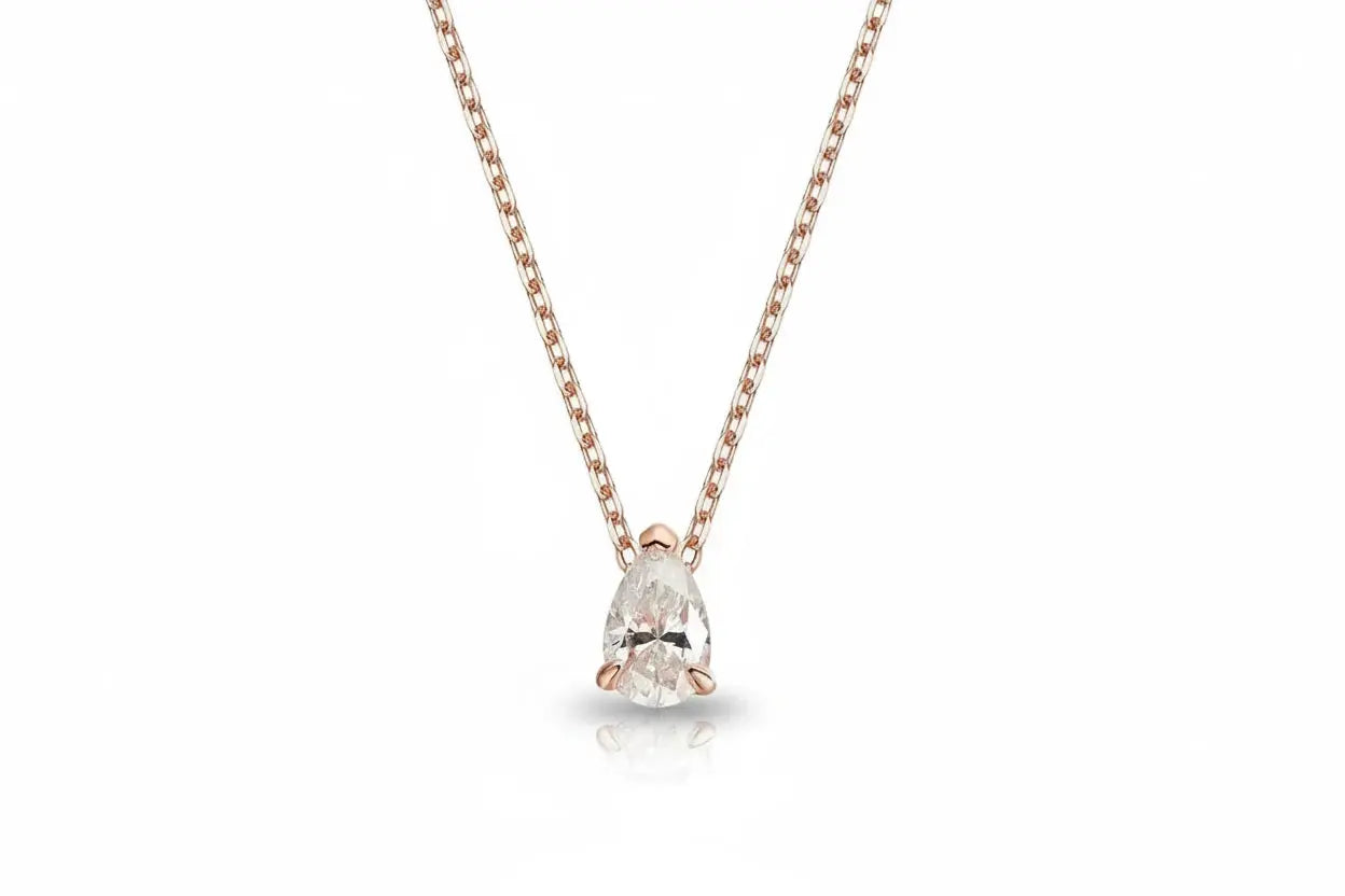 Elegant gold necklace with a pear-cut moissanite pendant, featuring 1-4 carats, from Zethech's Eternal Drop collection.