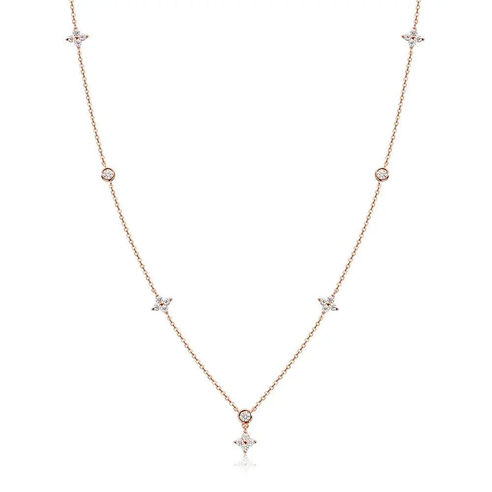 Zethech Knobspin Moissanite necklace featuring a four-leaf clover pendant in sterling silver with 18k gold plating, dainty and elegant.