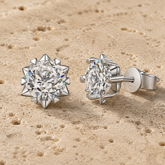Snowflake moissanite stud earrings showing the starburst setting and side profile
