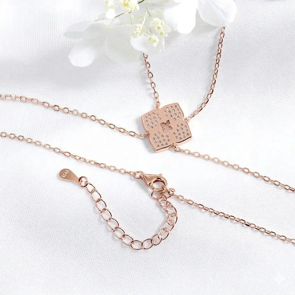 Elegant floral moissanite necklace by Zethech featuring sparkling gemstone designs on a delicate chain.
