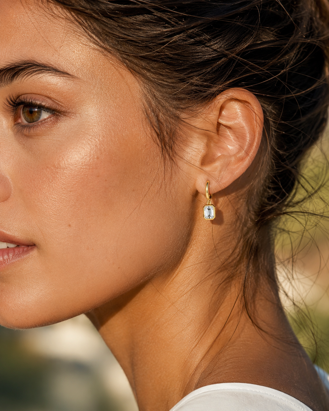Zethech Signature Emerald Drops worn on ear in yellow gold finish