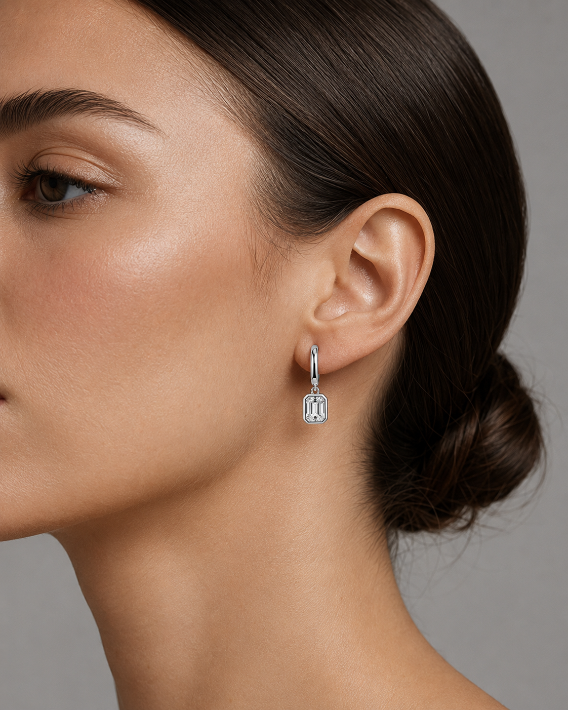 Zethech Signature Emerald Drops worn on ear in white gold finish