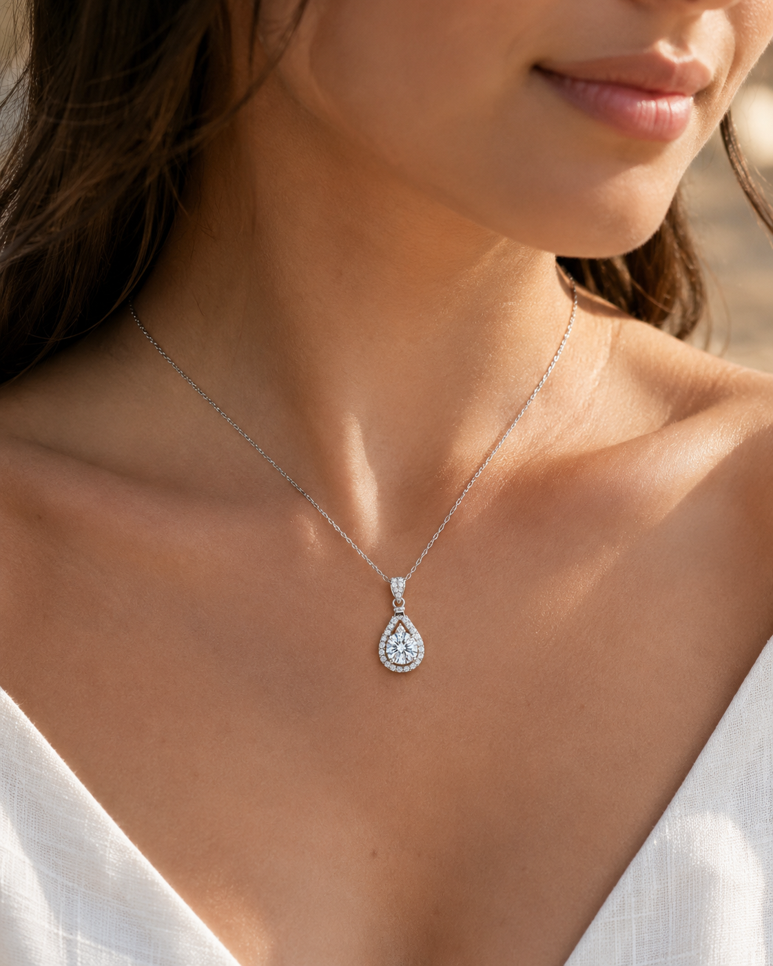 Close-up of Zethech Eclipse Drop Necklace worn with teardrop pendant