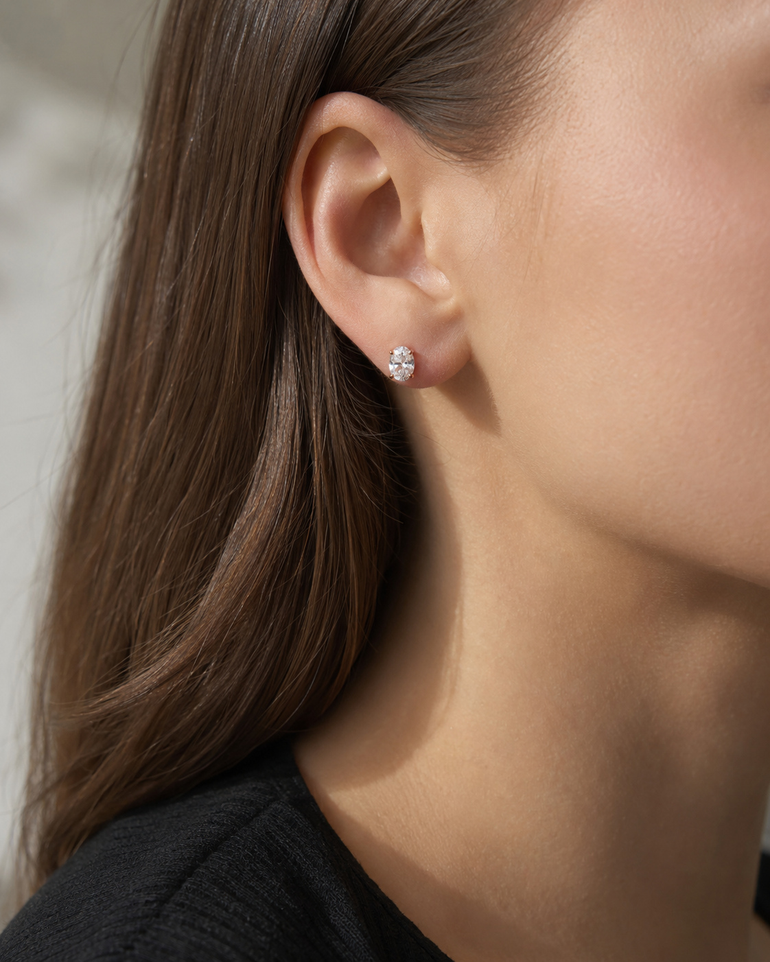 Zethech Verona Oval Studs worn on ear in close-up photo