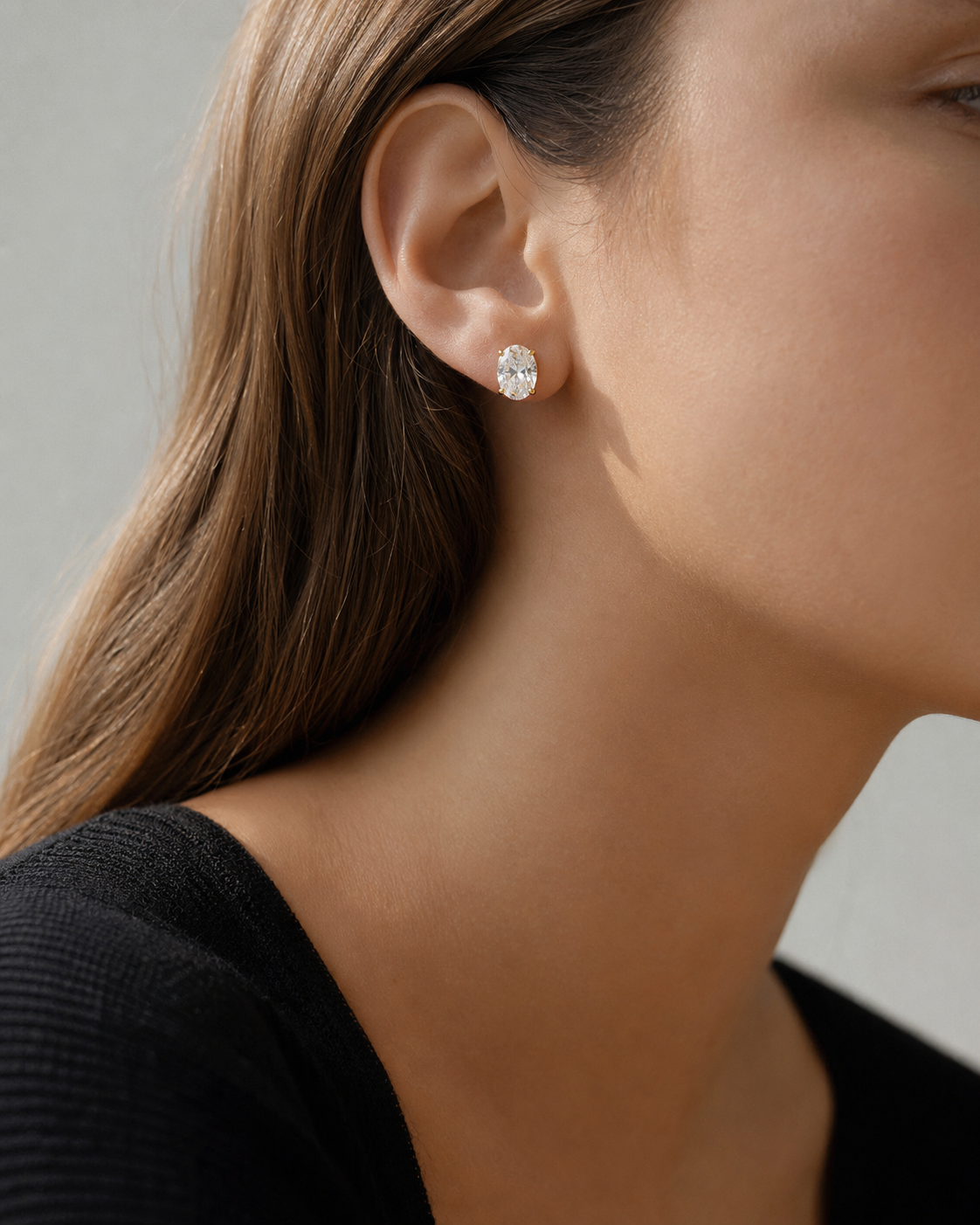 Close-up of Zethech Verona Oval Stud Earrings worn on ear