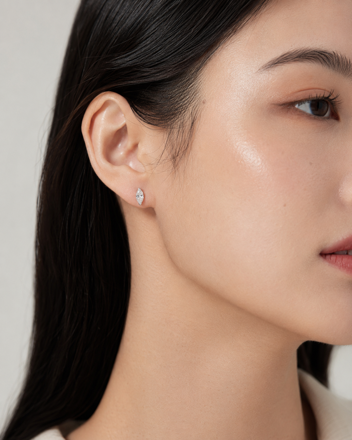 Close-up of Zethech Celeste Marquise Studs worn on ear