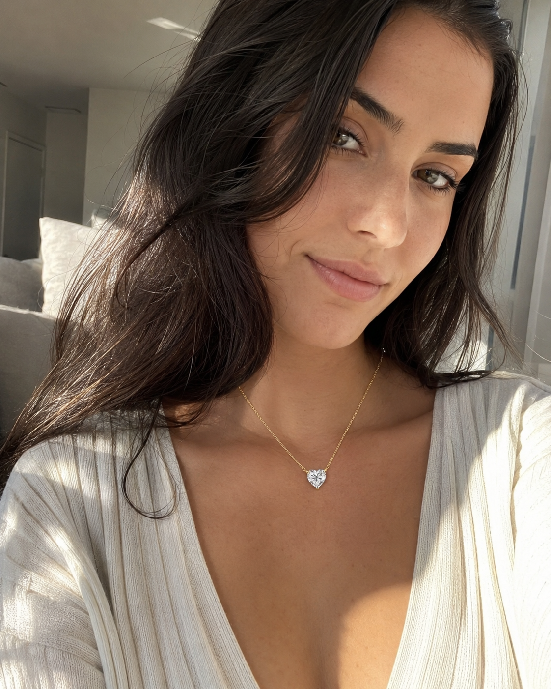 Zethech Celeste Heart Necklace worn outdoors with heart pendant visible
