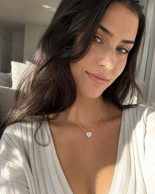 Zethech Celeste Heart Necklace worn outdoors with heart pendant visible