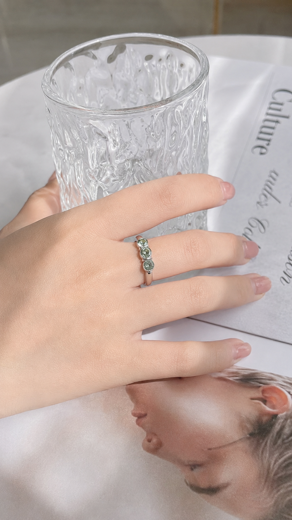 Zethech Halo Round Ring worn on hand while holding a glass