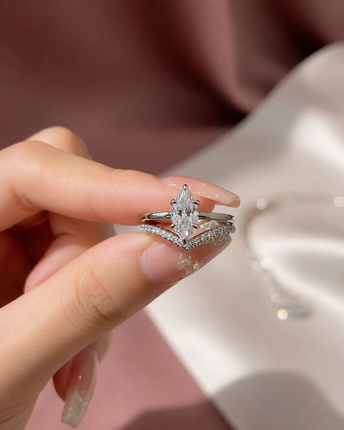 Zethech Velvet Marquise Ring held in hand with soft background