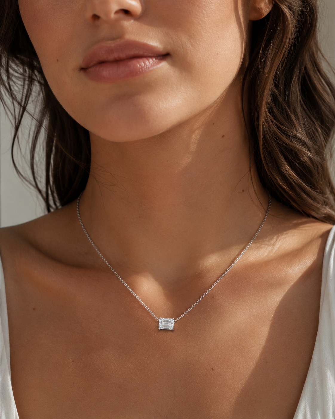 Zethech Verona Emerald Necklace worn on model with rectangular pendant