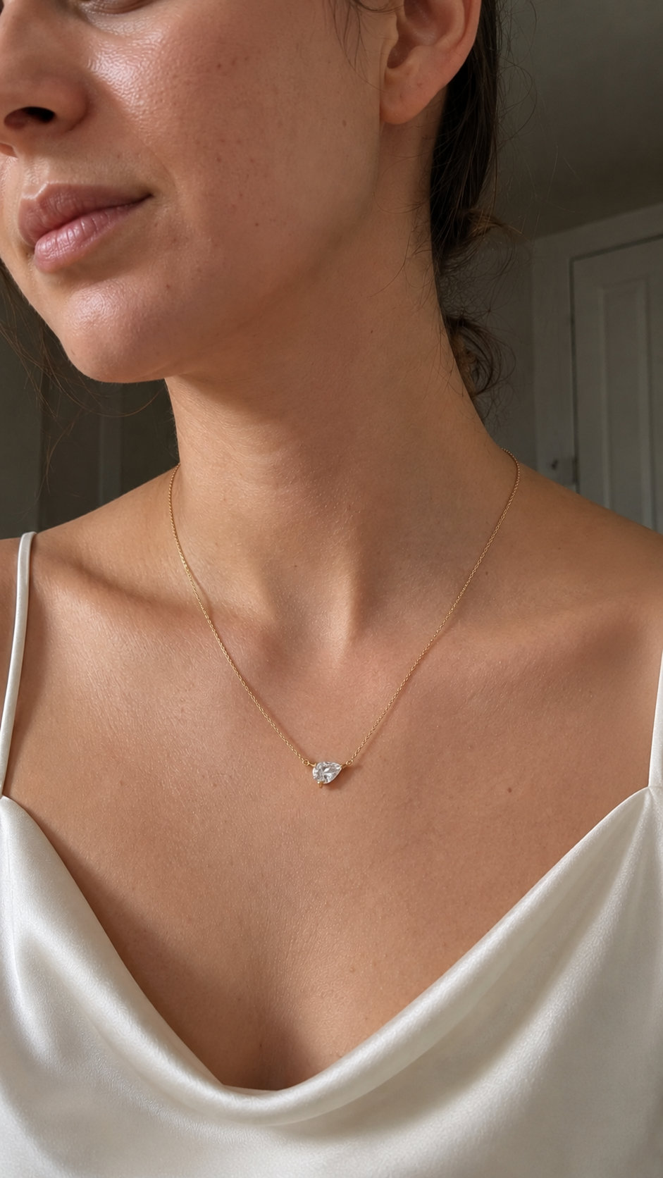 Close-up of Zethech Pear Drop Necklace with pear moissanite stone