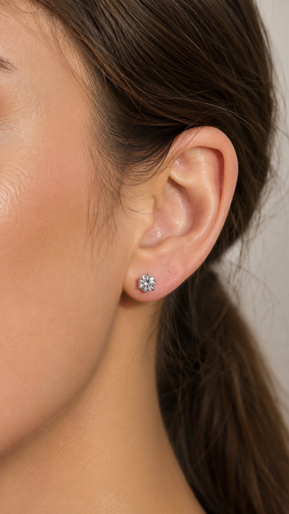 Close-up of Zethech Round Stud Earrings with prong setting