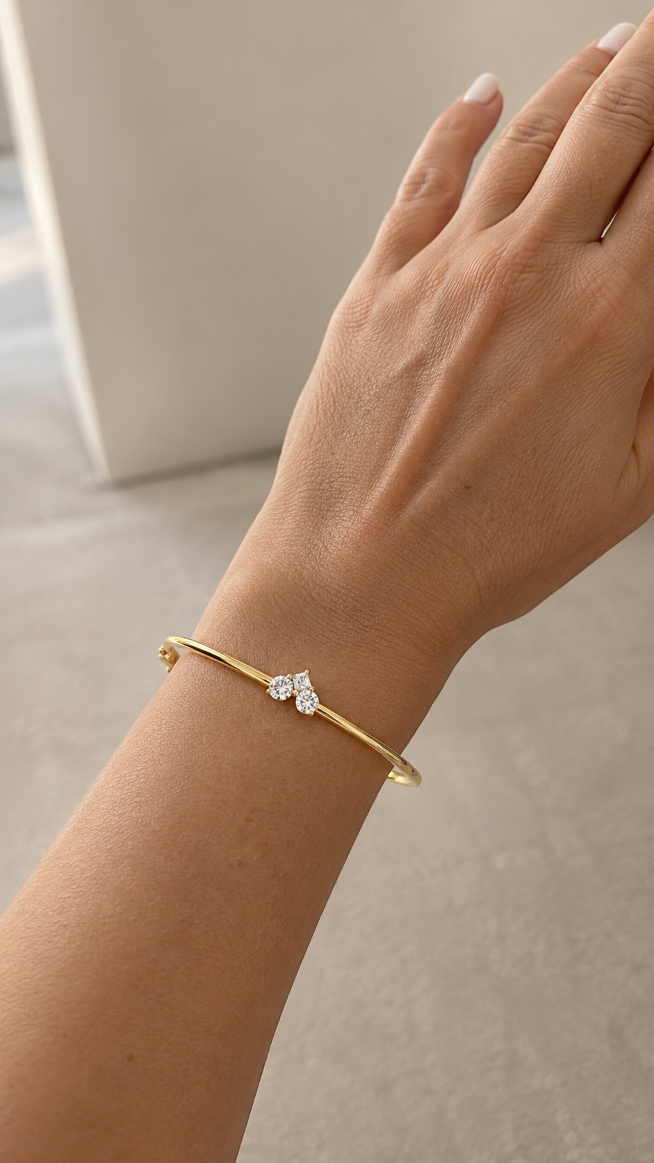 Zethech Radiant Cut Bangle in yellow gold finish with moissanite