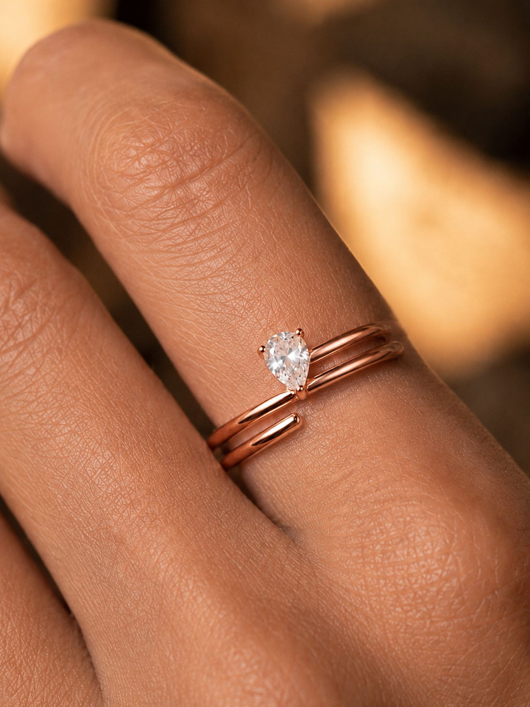 Close-up of Zethech Pear Moissanite Ring with pear center stone