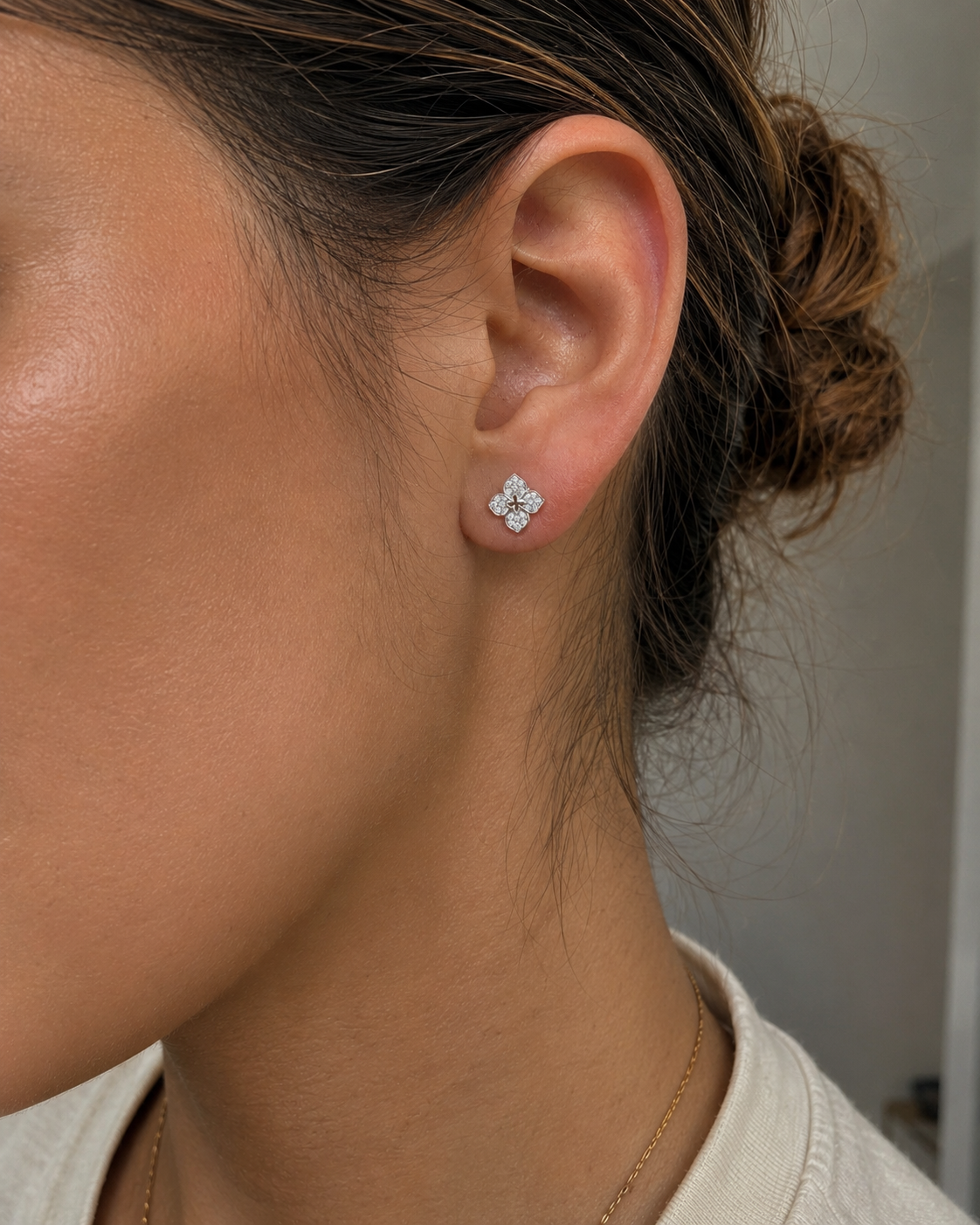 Close-up of Zethech Flower Moissanite Studs with floral design