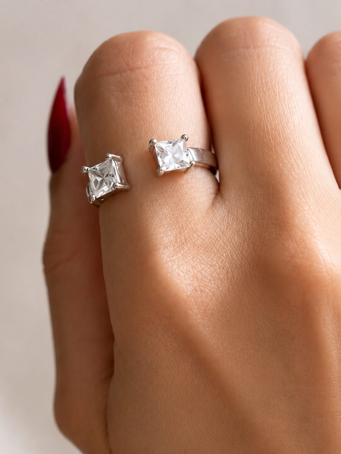 Close-up of Zethech Princess Moissanite Ring with square center stone