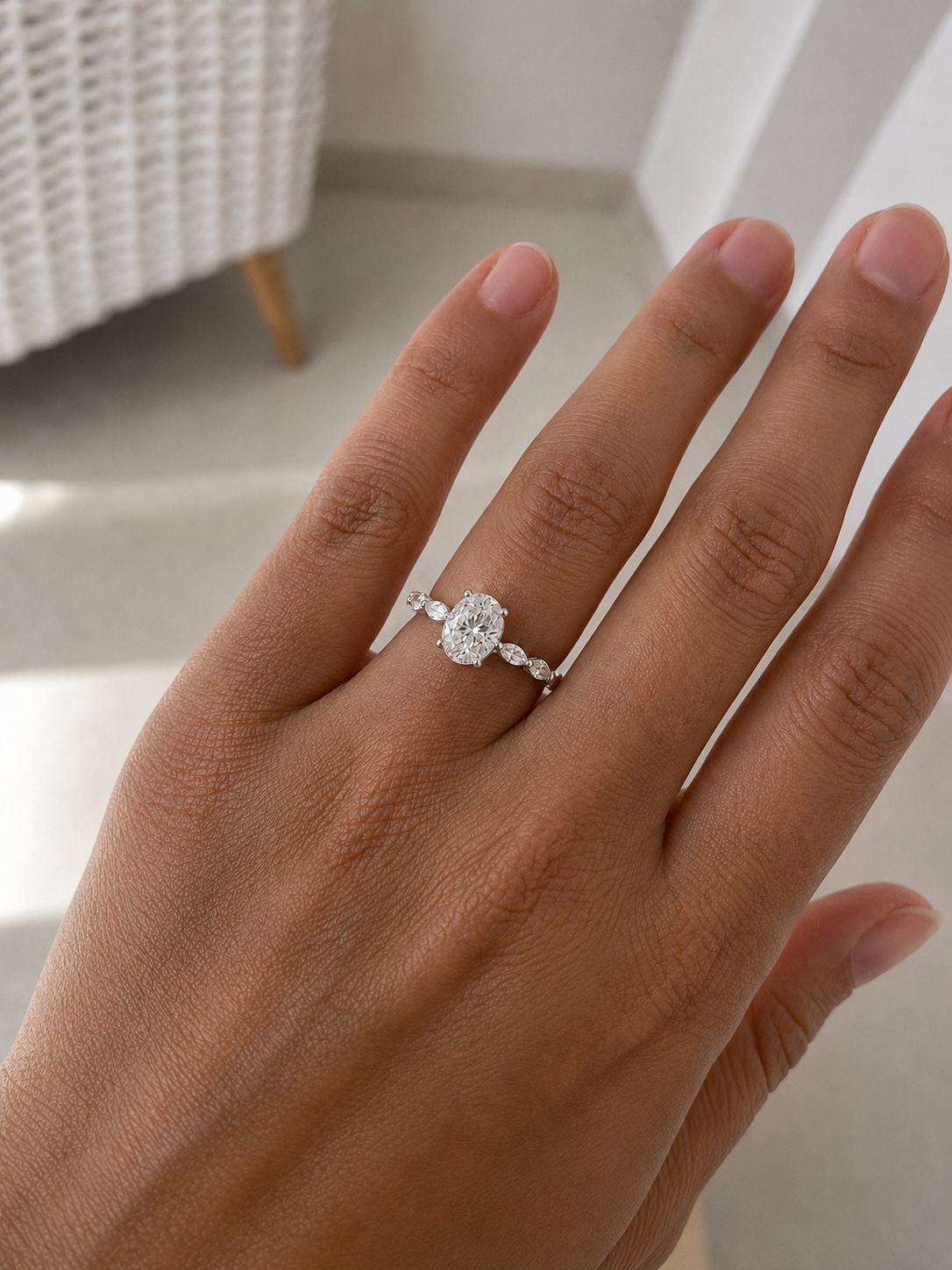 Zethech Oval Moissanite Ring on model hand in refined jewelry photo