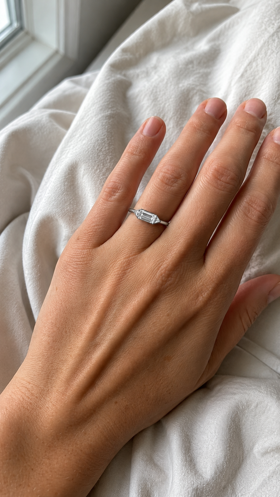 Zethech three-stone moissanite ring shown from refined jewelry angle