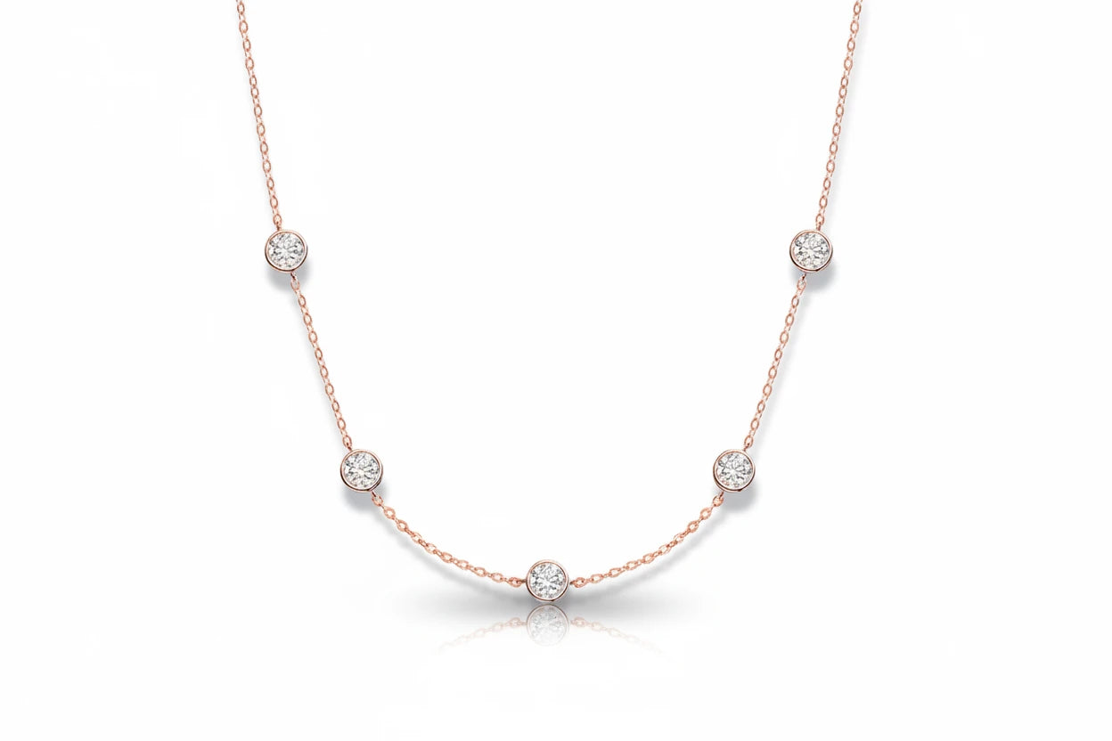 Elegant Bubble Moissanite Necklace by Zethech with sparkling round gemstones on a delicate chain.