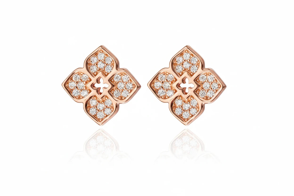 Zethech flower-shaped moissanite stud earrings with sparkling gemstones and silver posts on a white background.