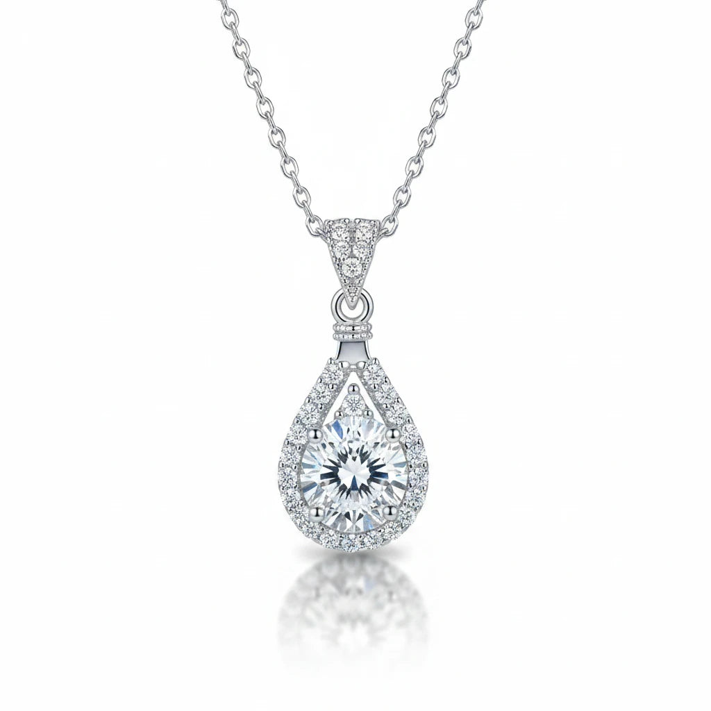Zethech Eclipse Drop Necklace with teardrop pendant on textured background