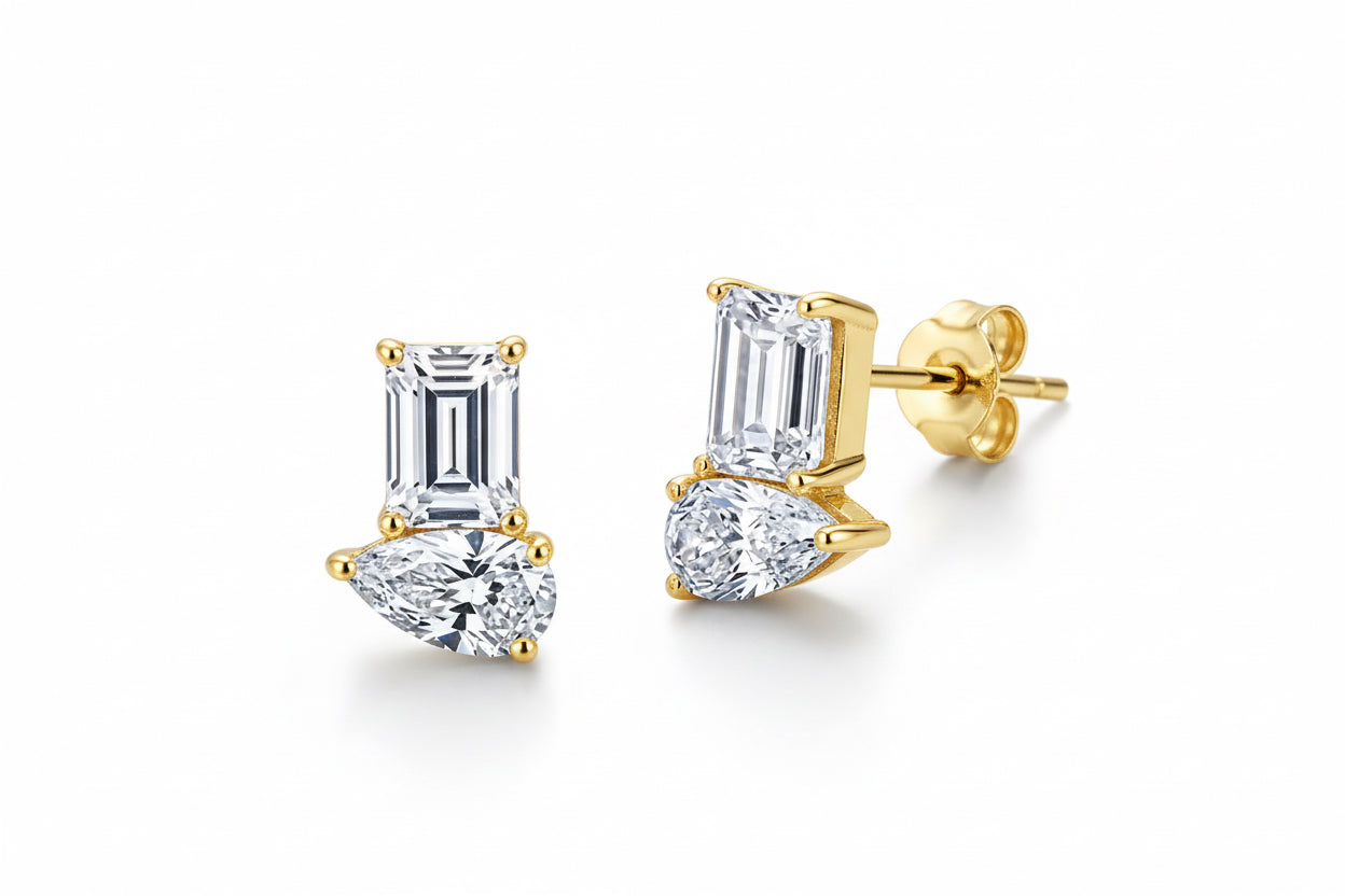 Diamond earrings on a green textured background