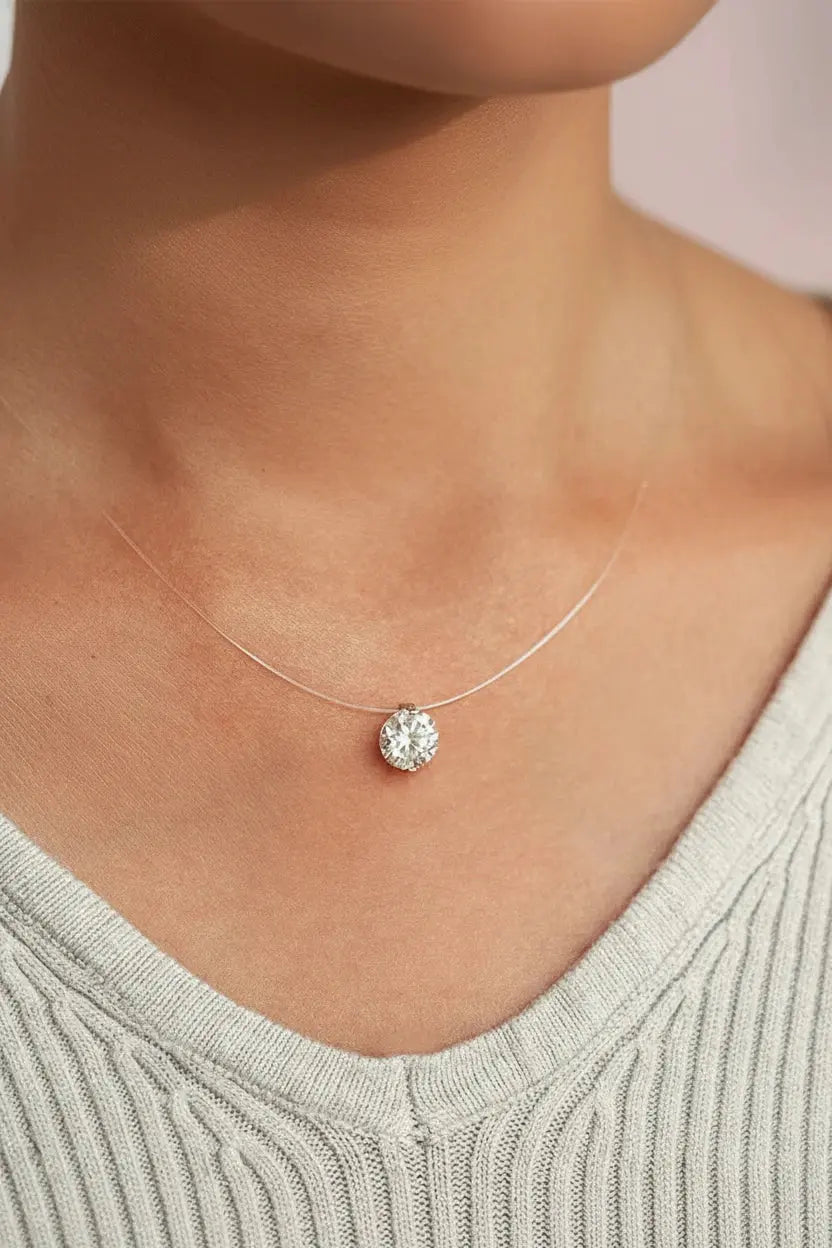 Zethech Signature Silhouette Moissanite Pendant necklace featuring oval-cut and round brilliant-cut moissanite stones in silver.
