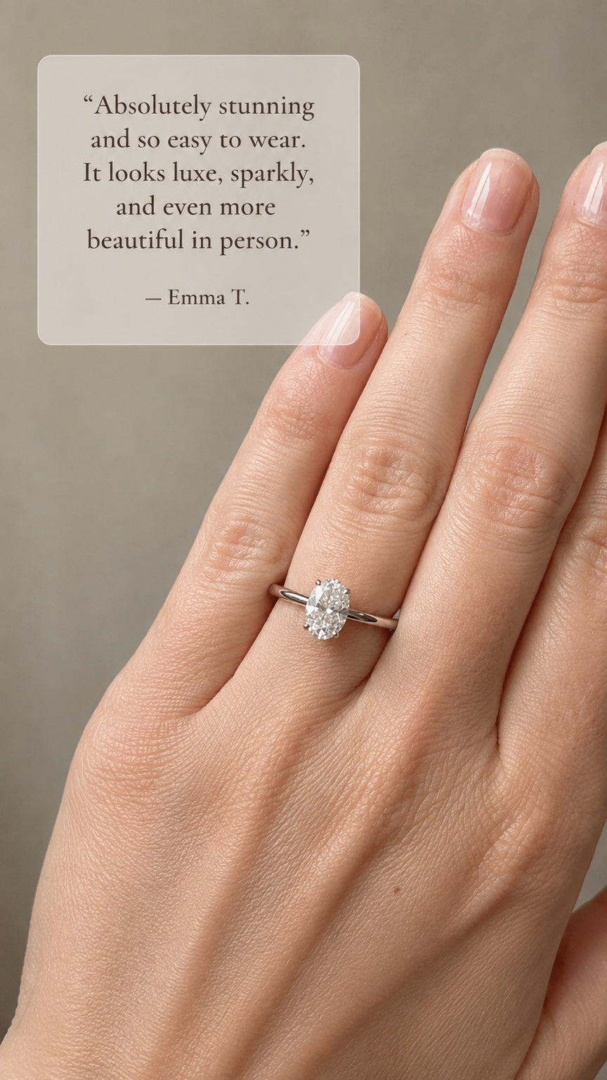 Customer wearing an oval moissanite ring. Testimonial: “Absolutely stunning and so easy to wear. It looks luxe, sparkly, and even more beautiful in person.” — Emma T.