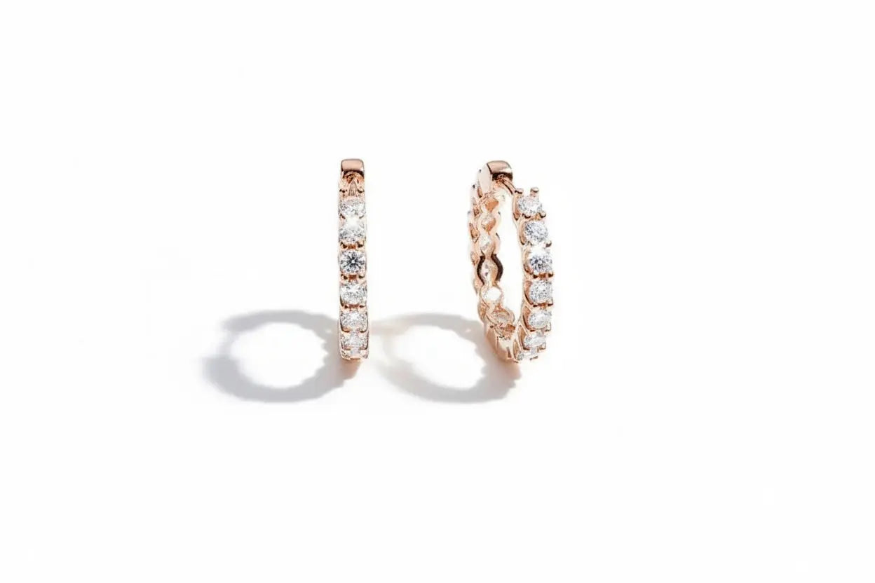 Gold-colored Zethech Eternal Glow 2.5mm full moissanite hoop earrings, showcasing sleek round earrings with sparkling stones.