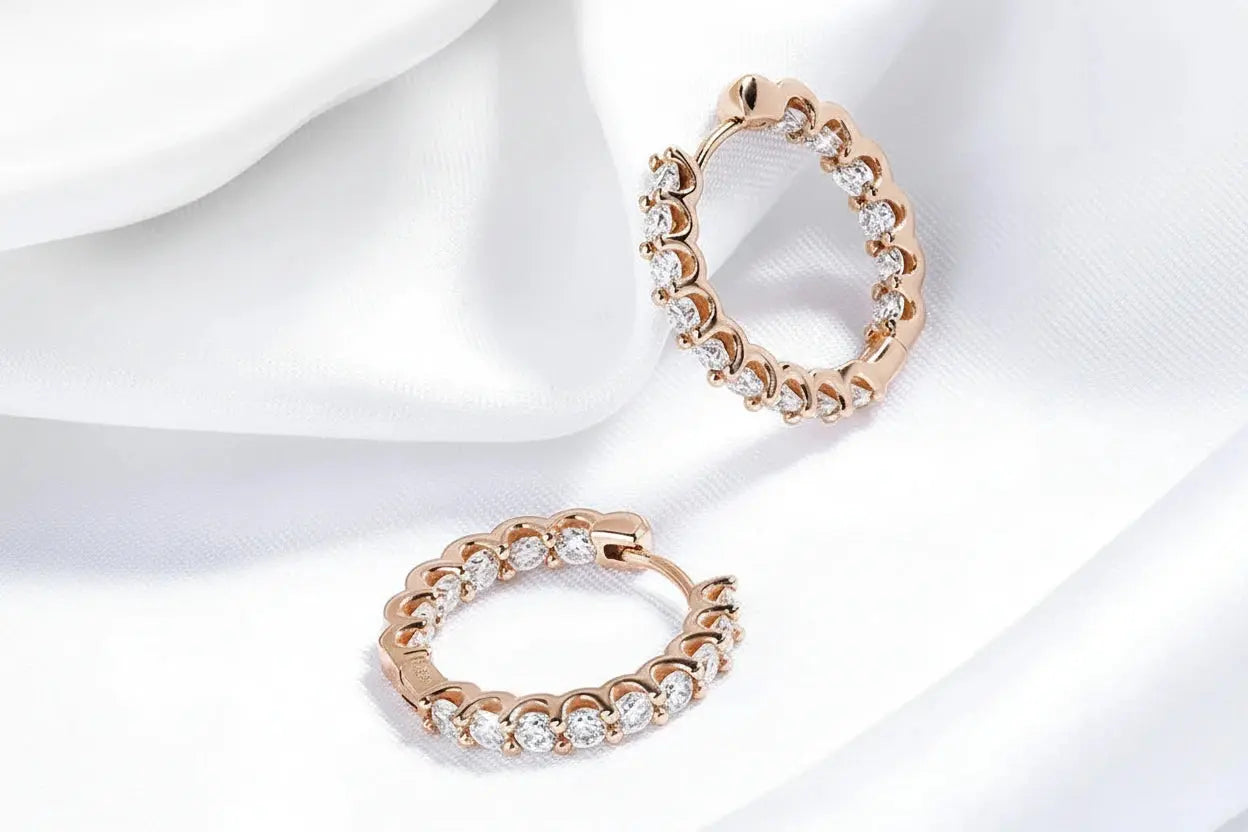 Gold-colored Zethech Eternal Glow 2.5mm full Moissanite hoop earrings, showcasing sparkling gemstone details and sleek design.