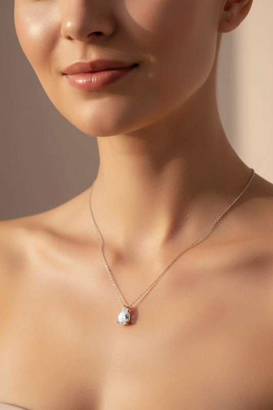 Gold Pear Drop Necklace by Zethech featuring a 3ct pear-cut moissanite pendant on a silver 925 chain, fine jewelry for women.