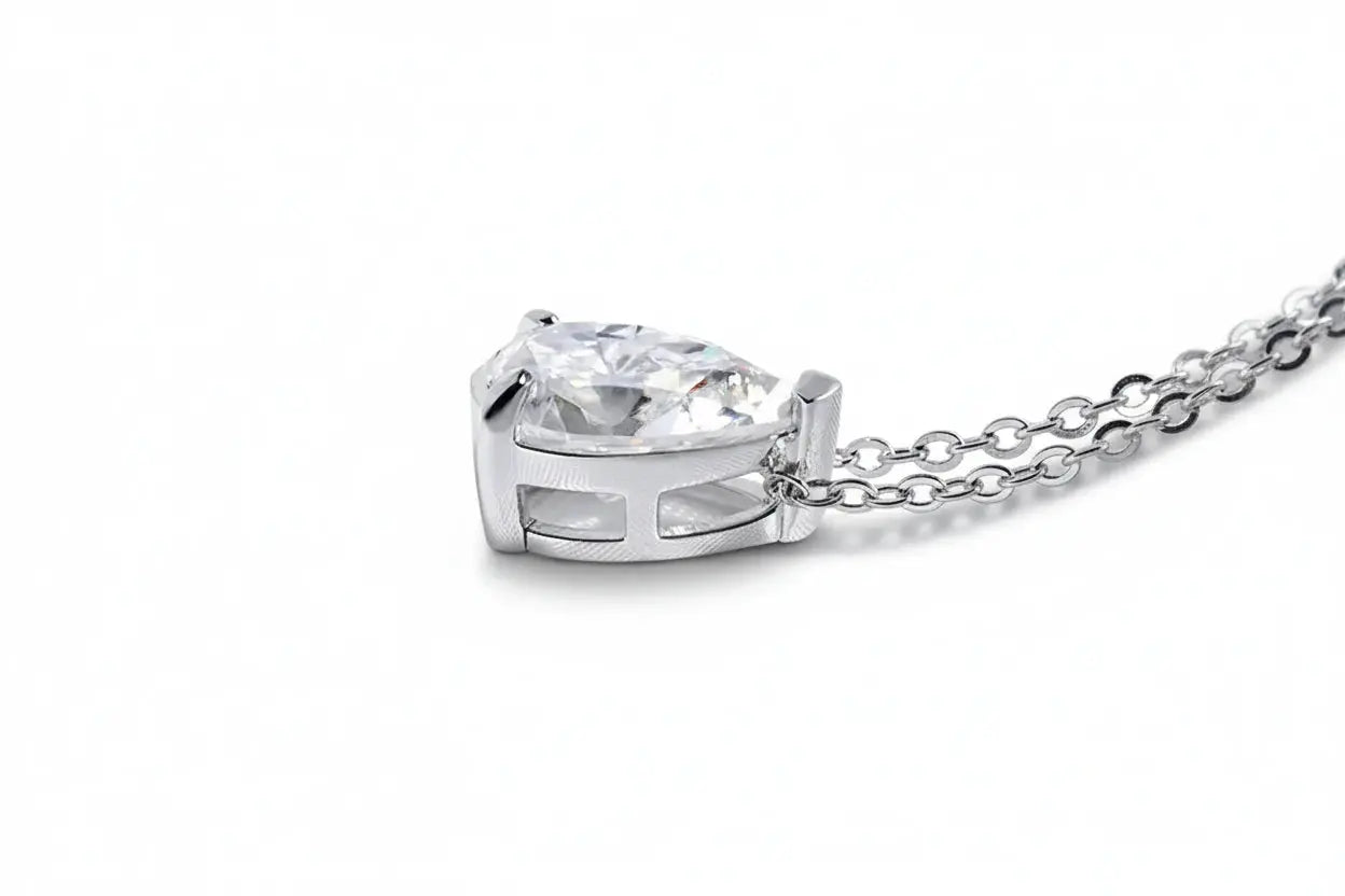 Gold pendant necklace with 1-4CT pear-cut moissanite by Zethech., featuring elegant lab-created diamond-like gemstones for women.