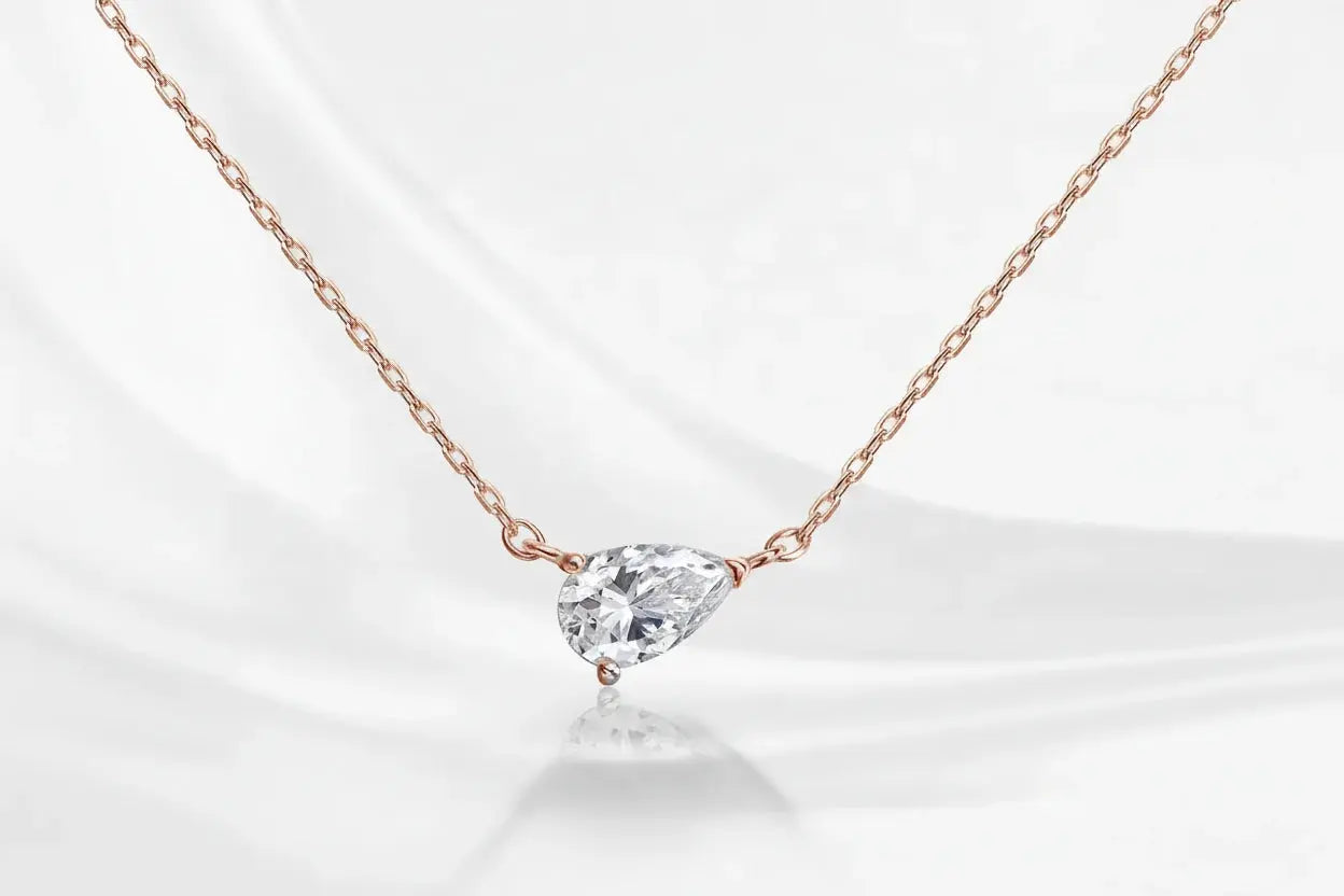 Gold necklace featuring a 1-4ct pear-cut moissanite pendant from Zethech, elegant fine jewelry for women and girls.