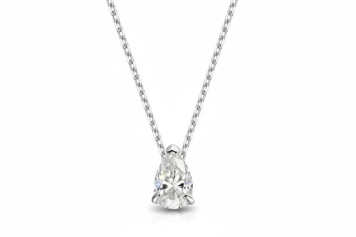 Gold necklace with a 1-4 carat pear-cut moissanite pendant, featuring elegant lab diamond design and silver 925 chain.
