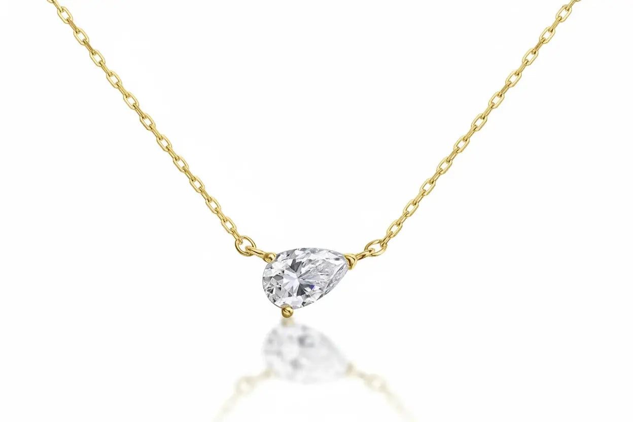 Elegant gold necklace with a 1-4CT pear-cut moissanite pendant from Zethech, featuring fine jewelry design on a silver 925 chain.