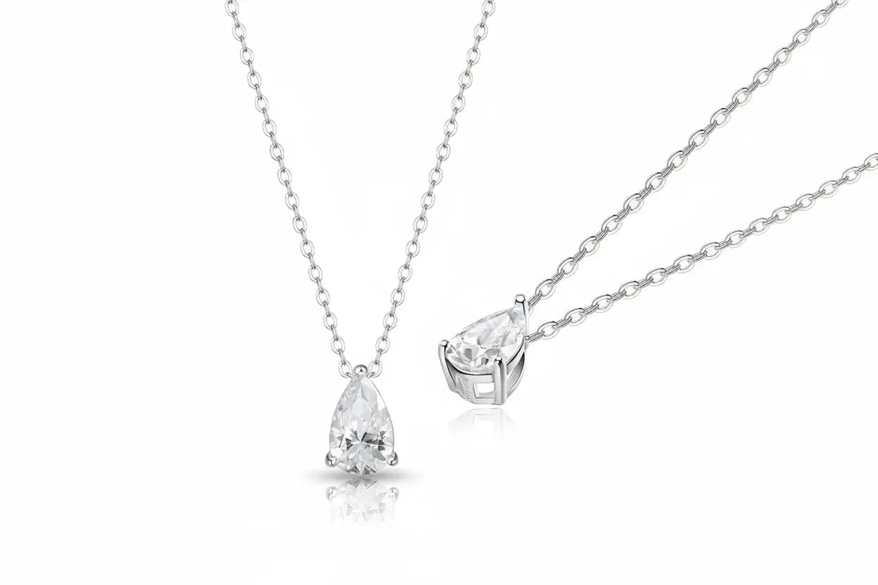 Gold necklace with a 1-4 carat pear-cut moissanite pendant, featuring three elegant designs on silver 925 chain.