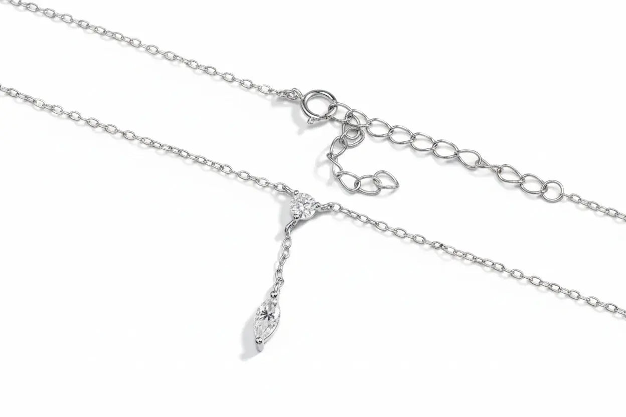Rose gold moissanite pendant necklace with marquise cut gemstone, sterling silver chain, elegant dainty design for women.