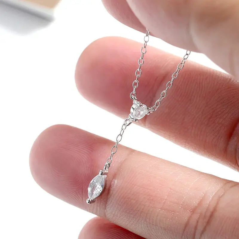 Rose gold Moissanite pendant necklace featuring a marquise cut gemstone, crafted in sterling silver, 45cm dainty chain.