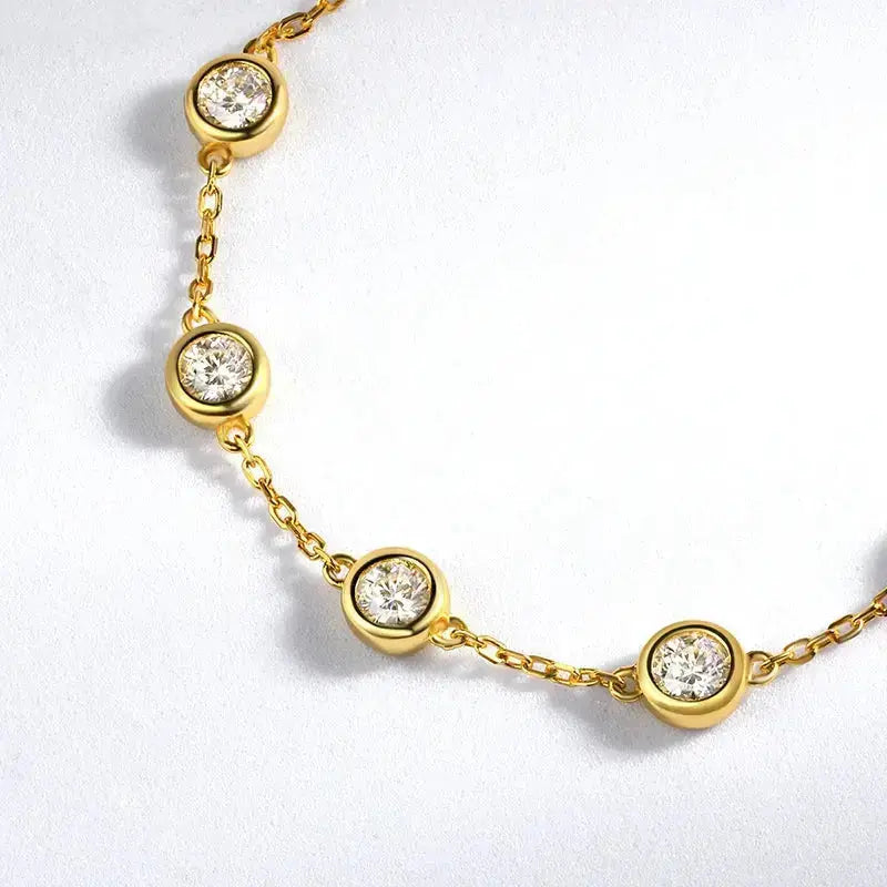 Silver Zethech Radiant Bubble Moissanite Tennis Bracelet with sparkling round stones on a delicate chain.