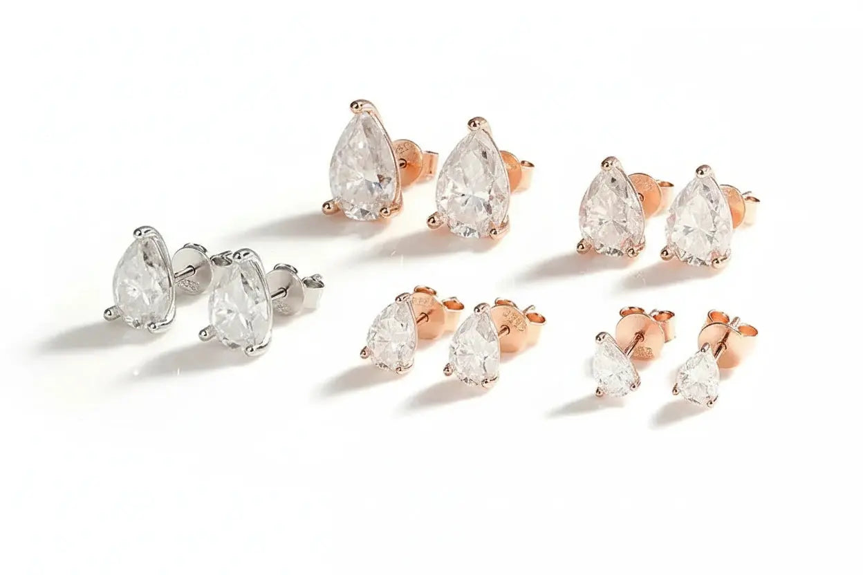 Silver-colored Zethech Radiant Teardrop Moissanite Stud Earrings with pear-cut, 1ct each, sterling silver and 18k gold plating for women.