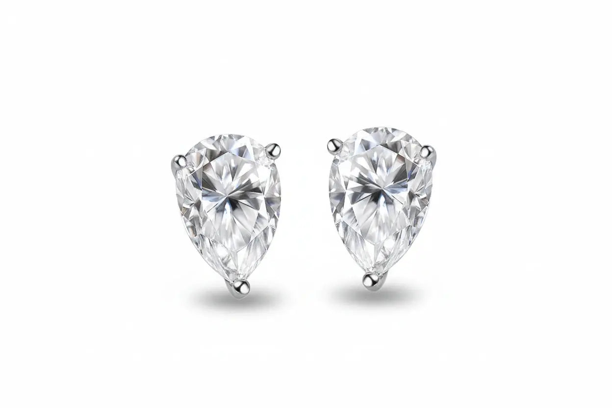Silver sterling silver and 18k gold plated moissanite stud earrings with pear-cut clear stones, perfect for elegant women’s jewelry.