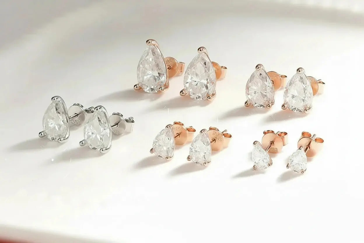 Silver-tone Zethech Radiant Teardrop Pear Cut Moissanite Stud Earrings, 1ct each, sterling silver with 18k gold plating, elegant jewelry for women.