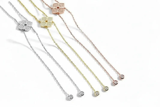 Silver floral Moissanite pendant necklace by Zethech featuring sparkling gemstone on a delicate chain.